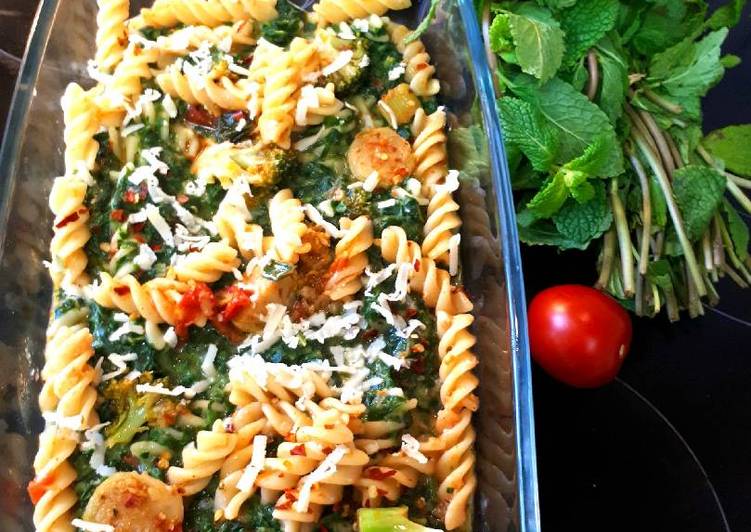 Yoghurt fusilli pasta in spinach puree