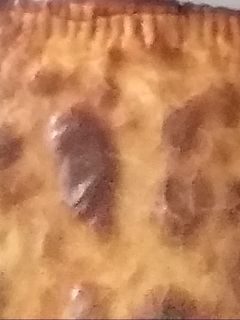 Una foto de Empanada cebolla caramelizada, morcilla y queso de cabra