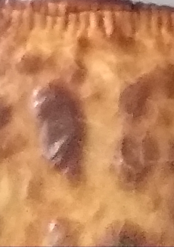 Una foto de Empanada cebolla caramelizada, morcilla y queso de cabra