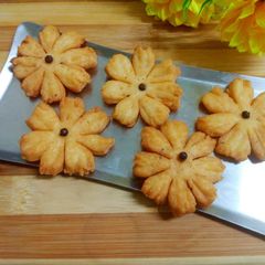 A picture of Flower shape mathri with wheat flour.