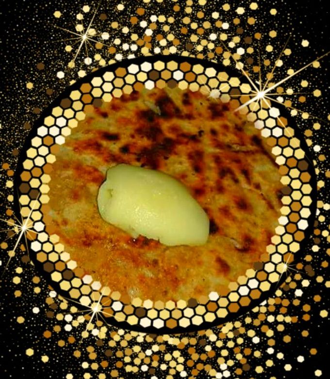 A picture of Paneer  paratha with  butter.