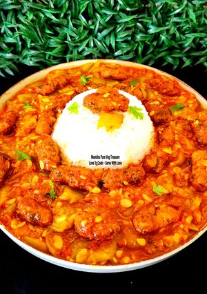 A picture of Methi Muthiya Tameta Galka Nu Shaak - Fist-Shaped Fried Methi Dumpling In Sponge Gourd Tomato Curry.