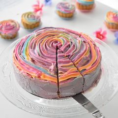 A picture of Carrot Cake with rainbow frosting.