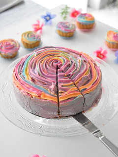 A picture of Carrot Cake with rainbow frosting.