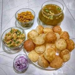 A picture of PANIPURI /SPHERICAL CRISPY DISH FILLED WITH SPICY WATER.