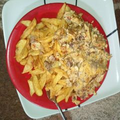 A picture of Fried chips with scrambled eggs.