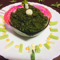 A picture of Green garlic mint leaves coriander chutney green chutney.