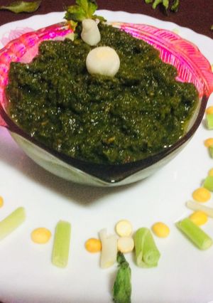 A picture of Green garlic mint leaves coriander chutney green chutney.