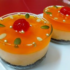 A picture of Orange cheesecake with orange jelly.