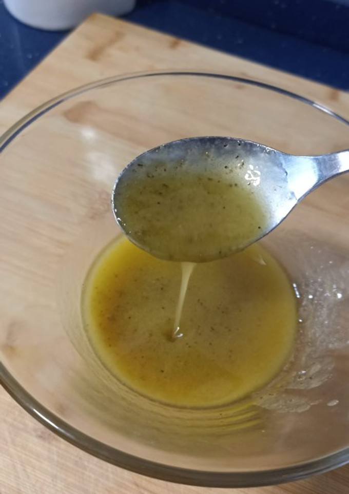 Una foto de Vinagreta de ajo confitado