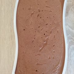 A picture of Chocolate mousse with cream and egg yolk.
