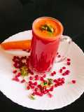 Pomegranate seeds with carrot juice
