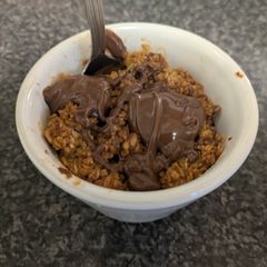 A picture of Apple crumble with a peanut butter surprise.
