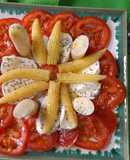 Tomates, mazorquitas, palmitos y mozzarella con semillas de amapola