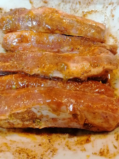 Una foto de 299. Costillas y bistec en adobo de achiote