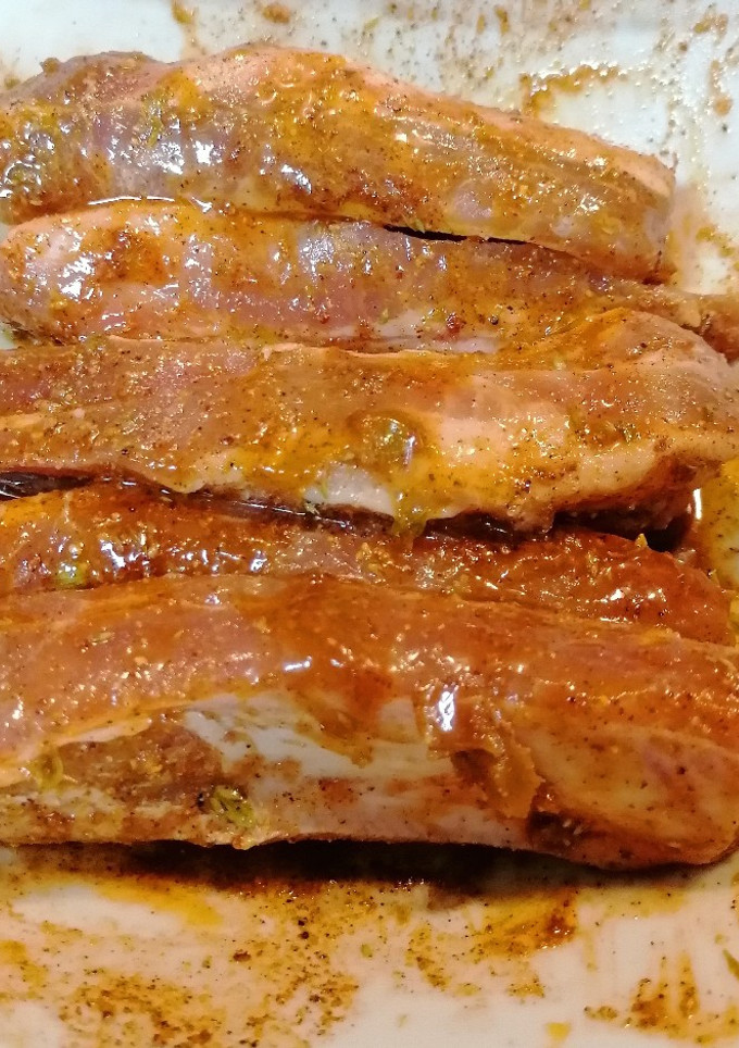 Una foto de 299. Costillas y bistec en adobo de achiote