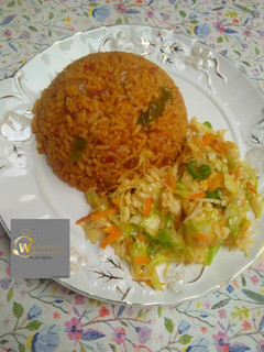 A picture of Jollof Rice with Salad.