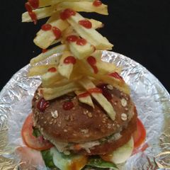 A picture of Veg Burger with French Fries Tower.