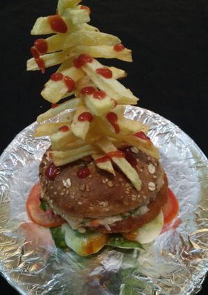 A picture of Veg Burger with French Fries Tower.