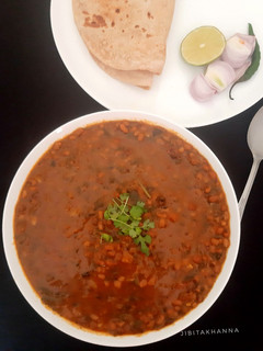 A picture of Moth Beans with Spinach and Jute Leaves (cooked with whey water).
