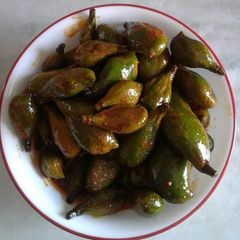 A picture of Raw baby mango pickle.