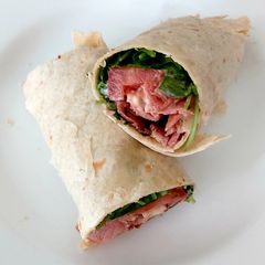 A picture of My Bacon,Tomato,Wild Rocket & soft cheese + Mayonnaise Wrap 😍.