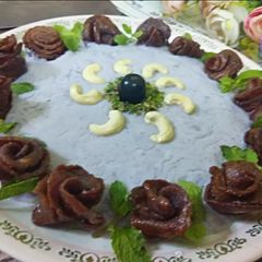 A picture of Blueberry Rabri with Crunchy Roses.