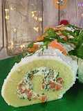 Rotolo verde con crema di formaggi, salmone e rughetta