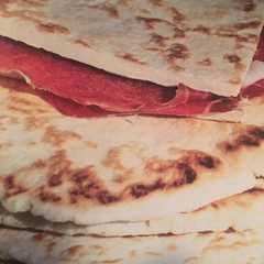 A picture of Piadina al prosciutto! La merenda di Vittoria 😍.