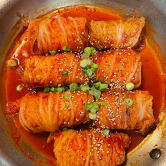 A picture of Kimchi cabbage rolls.
