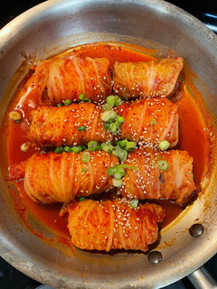 A picture of Kimchi cabbage rolls.