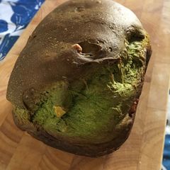 A picture of Bread Machine Matcha Bread with Walnuts and Raisins.