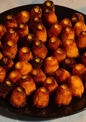 A picture of Mini Cannelés with Prosciutto.