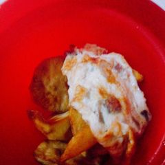 A picture of Fried egg, potatoes and plantain.