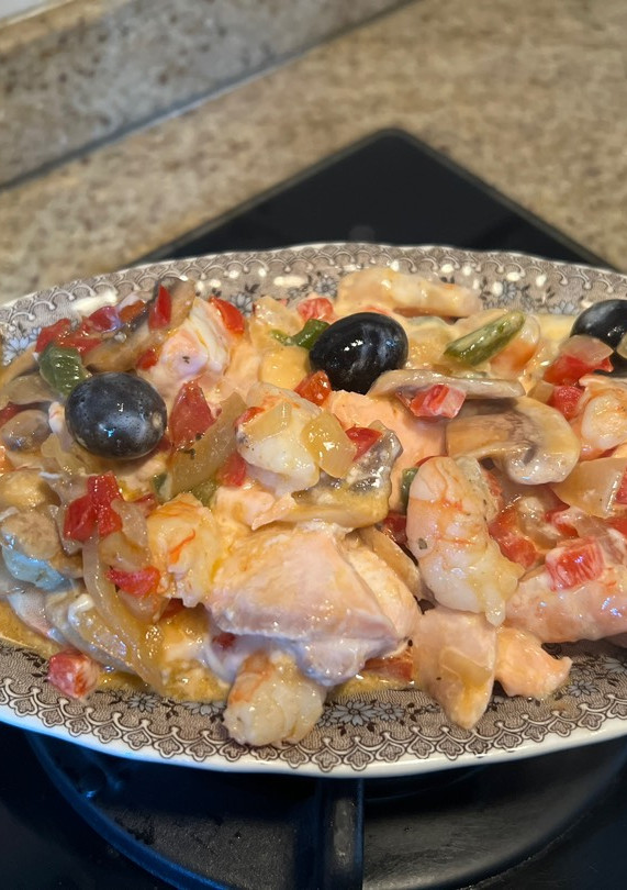 Una foto de Cremoso de salmón y langostinos