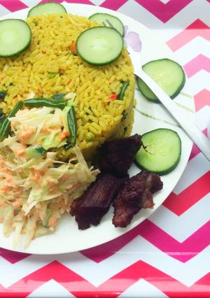 A picture of Fried rice and veggies.