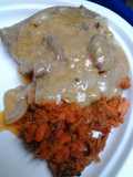 Butter gravy smothered sirloin with mashed carrots