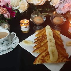 A picture of French Toast with Banana 🍌 😋.