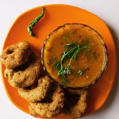 A picture of Mix dal vada with sambar.