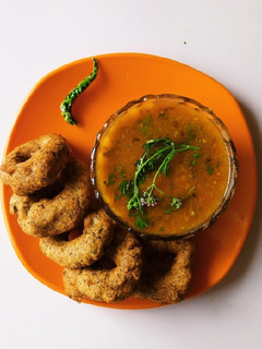 A picture of Mix dal vada with sambar.