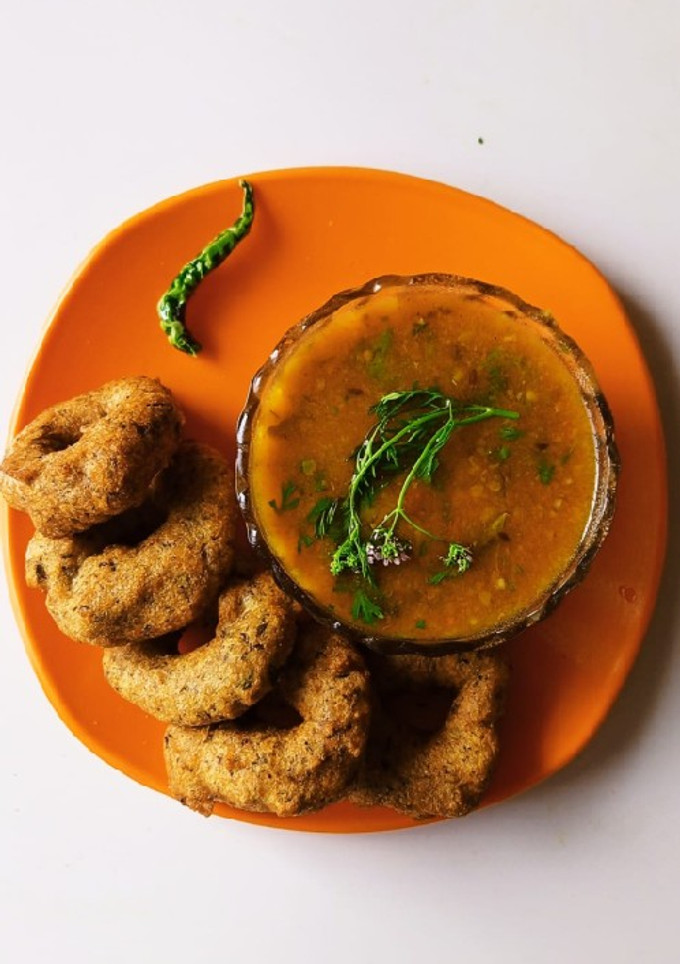 A picture of Mix dal vada with sambar.