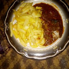 A picture of Chips and fish pepper soup.
