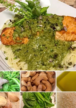 A picture of Grilled salmon with pesto on top of pasta.