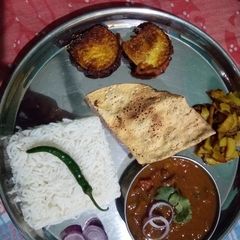 A picture of Rajma Chawal Baingan Fry Aloo Fry.