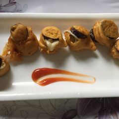 A picture of Baingan cheese pakoda.