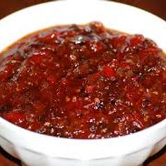 A picture of Tomato and anar danay Ki chatni.
