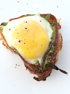 A picture of Asparagus And Egg In Bacon Cup.