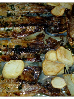 Una foto de Sarda horneada con patatas