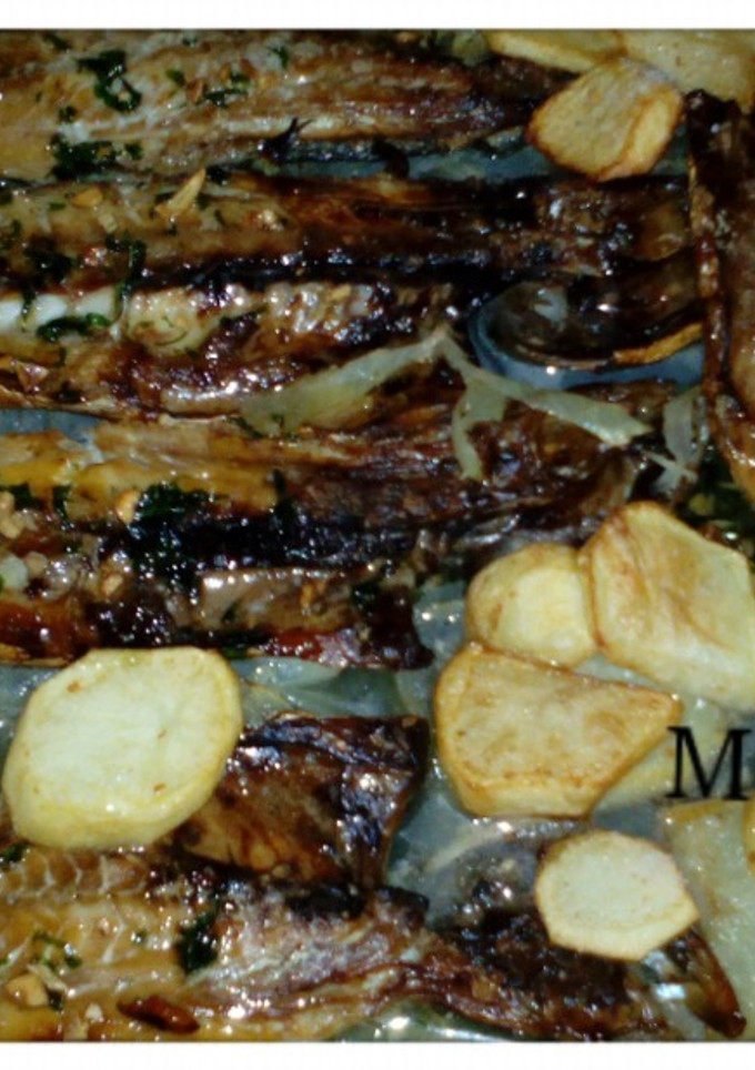 Una foto de Sarda horneada con patatas