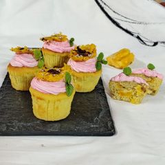 A picture of Jackfruit muffins with strawberry icing.